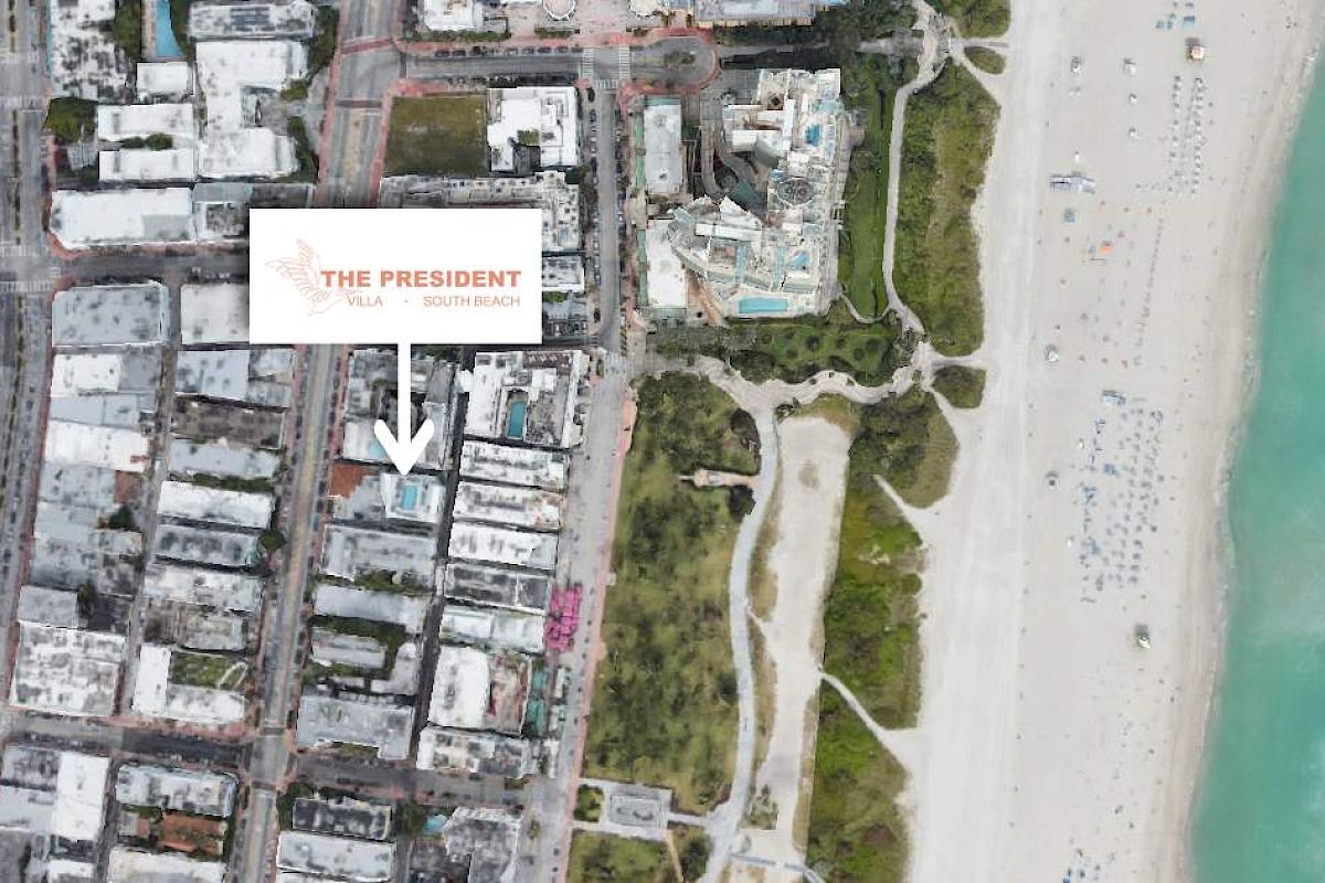 Satellite view showing urban area with a hotel labeled "The President," adjacent to a beach and coastline.
